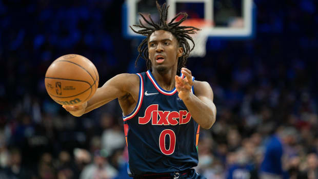 Tyrese Maxey (0) passes the ball against the Miami Heat.